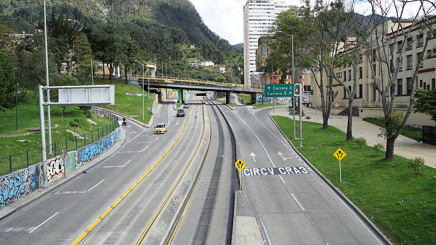 Urban Highway with Tram Tracks and Mountain Backdrop