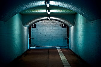 Dark Blue Brick Tunnel Corridor with Arched Ceiling