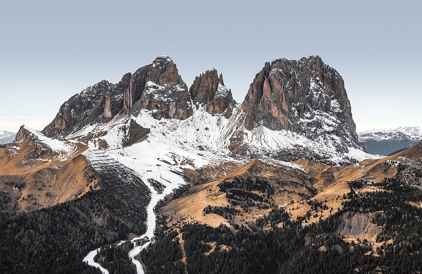 Majestic Dolomites Mountain Peaks with Snow and Forest