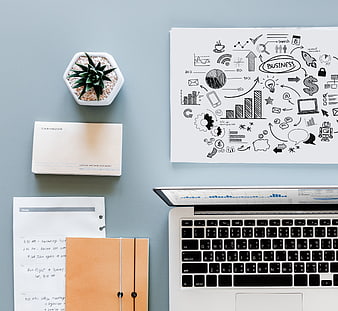 Modern Business Workspace Flat Lay With Laptop, Cashbook, And Business Sketches
