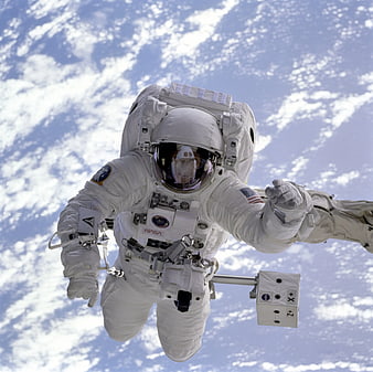 Astronaut in white spacesuit floating in space with Earth background