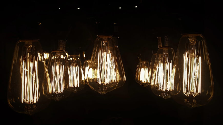 Vintage Edison Light Bulbs Hanging in Dark Room