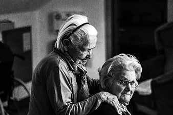 Black and white portrait of two senior women in a care home