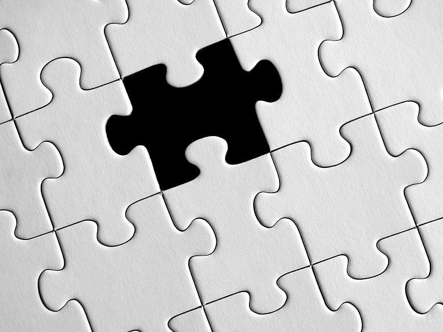 White Jigsaw Puzzle With Missing Black Piece Concept