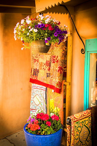 Colorful Flower Pots And Patchwork Textiles On A Santa Fe Porch