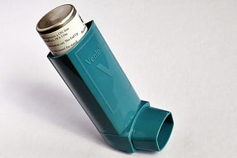 Ventolin Inhaler in Blue Case on White Background