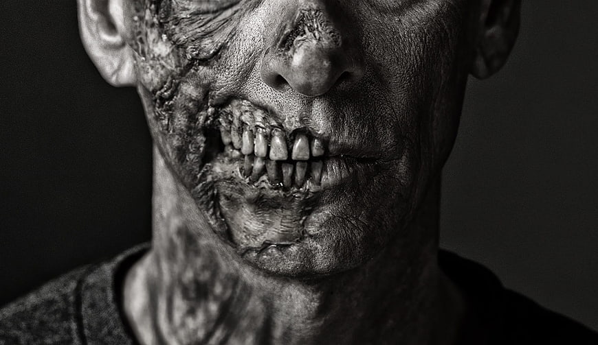 Close-up of a man with realistic zombie special effects makeup