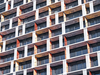 Modern Apartment Building Facade with Orange and White Balconies