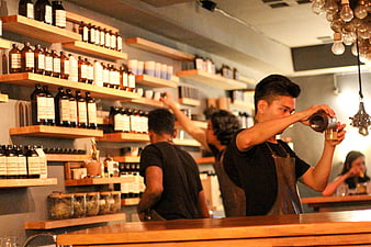 Pharmacist preparing medicine in modern apothecary shop