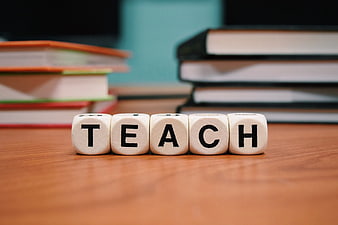 Teach Word on Wooden Dice with Books Background