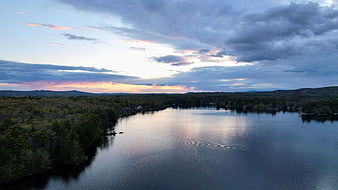 Aerial View of Serene Lake at Dusk with Colorful Clouds