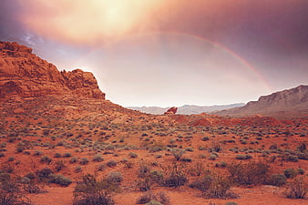 Rainbow Over Red Rock Desert Canyon Landscape at Dusk