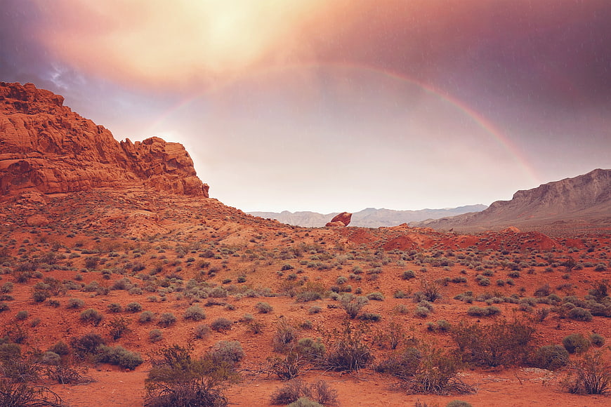 Rainbow Over Red Rock Desert Canyon Landscape at Dusk