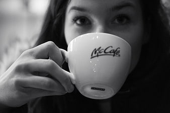 Woman drinking McCafe coffee in black and white