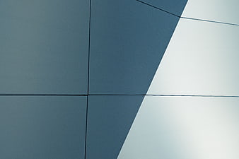 Abstract geometric architectural facade with blue and white panels