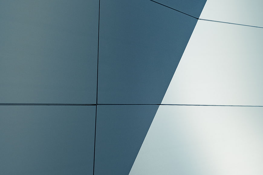 Abstract geometric architectural facade with blue and white panels