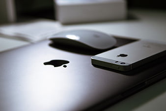 Silver MacBook, iPhone, and Mouse on Desk