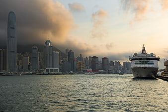 Hong Kong Skyline with Ferry at Sunset