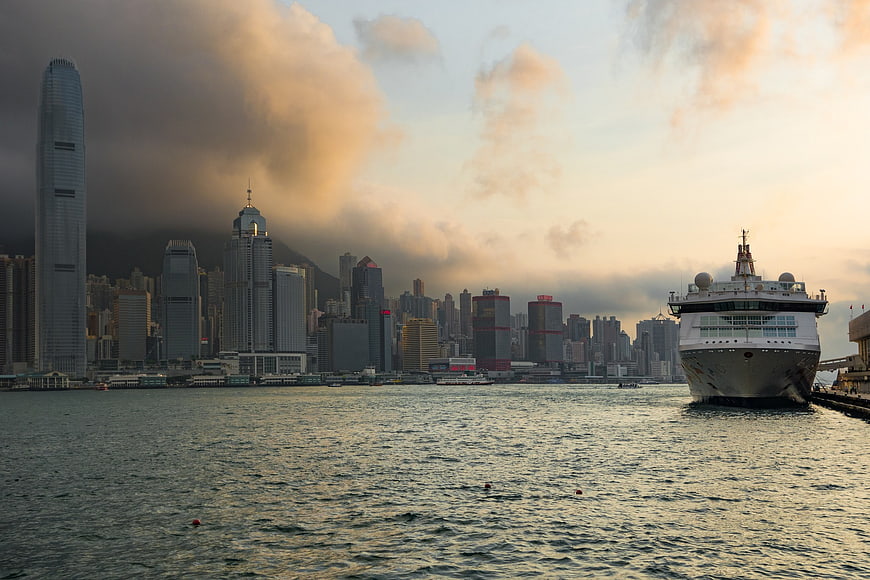 Hong Kong Skyline with Ferry at Sunset