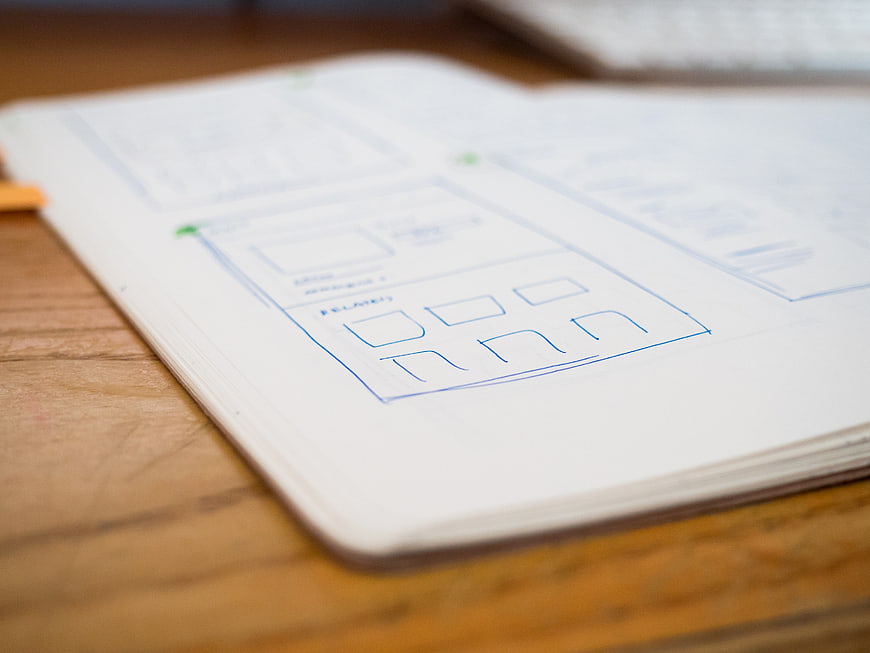 Hand-drawn wireframe sketch on notebook page