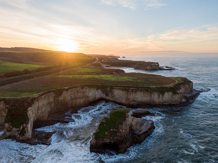 Aerial View of Dramatic Coastal Cliffs at Golden Hour