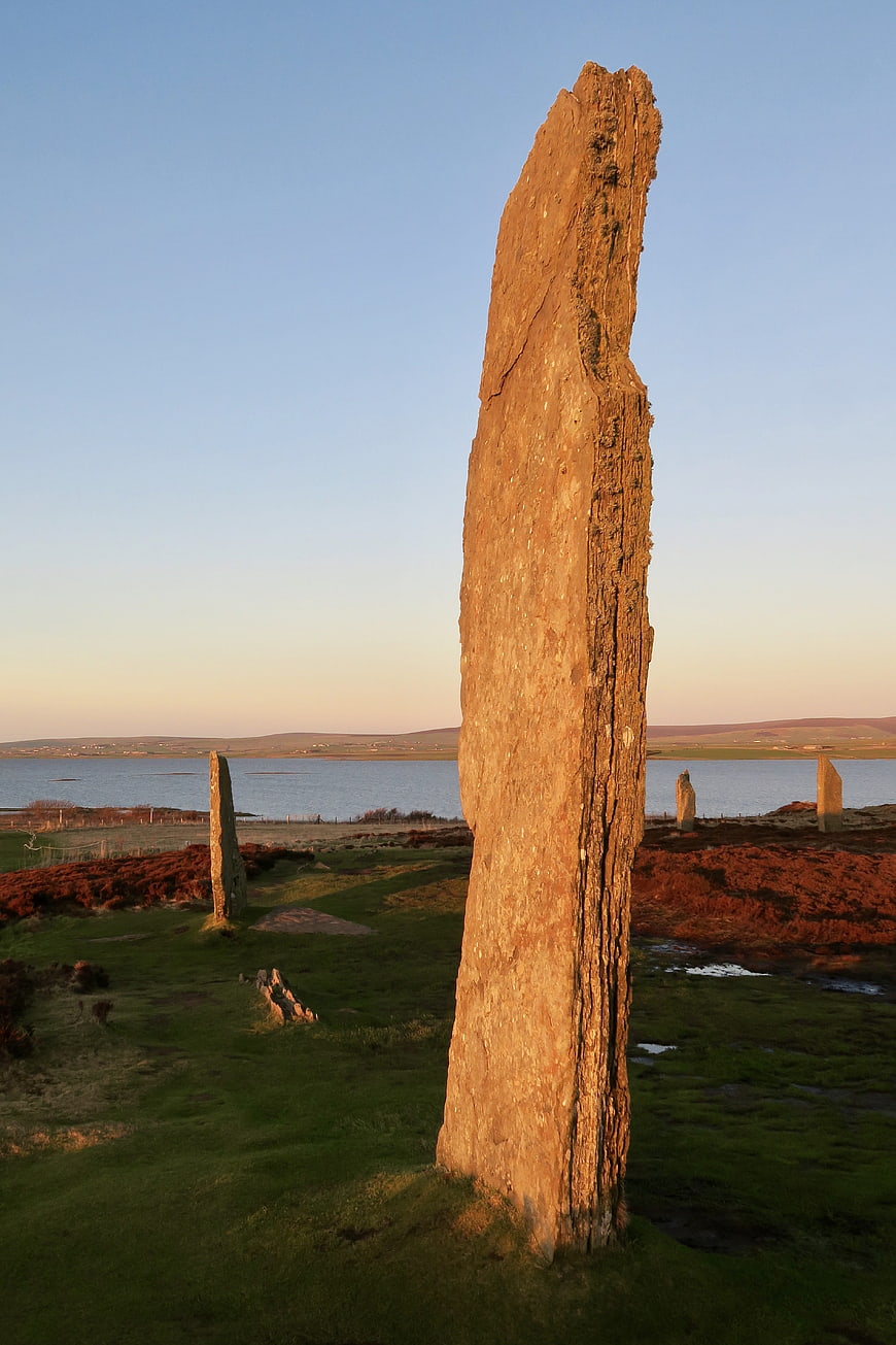 Ancient standing stone monument in Scottish landscape at sunset
