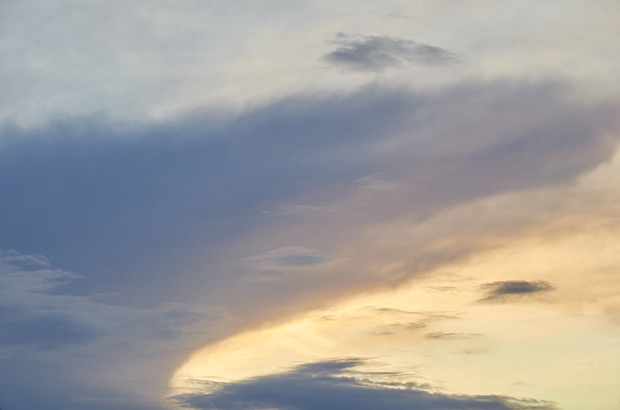 Dramatic sunset sky with golden light breaking through clouds