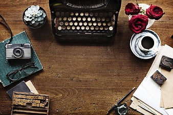 Vintage Typewriter and Camera Flat Lay on Wooden Desk