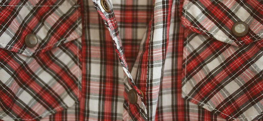 Close-up of red plaid flannel shirt texture