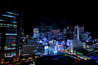 Tokyo City Skyline At Night With Illuminated Buildings
