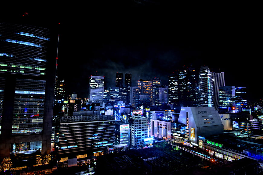 Tokyo City Skyline At Night With Illuminated Buildings
