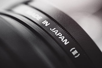 Close-up of camera lens with Made in Japan text