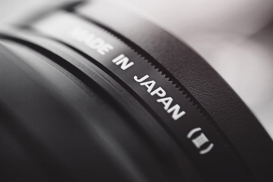 Close-up of camera lens with Made in Japan text