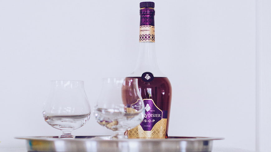 Cognac bottle and glasses on silver tray