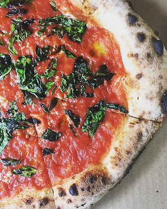 Close-up of authentic Neapolitan Margherita pizza with basil