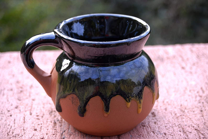 Handcrafted Ceramic Pitcher with Glazed Rim