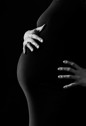Black and White Pregnant Woman Belly Close Up