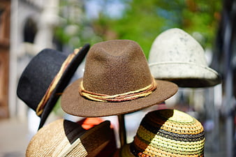Brown Fedora Hat Display with Colorful Accessories