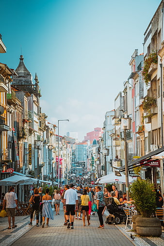 Pedestrians Walking on Historic European Shopping Street