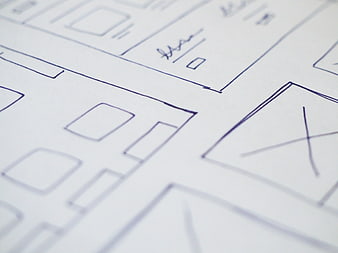 Hand-drawn architectural blueprint sketch on white paper