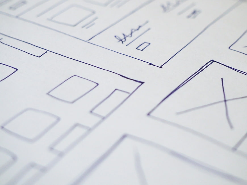 Hand-drawn architectural blueprint sketch on white paper
