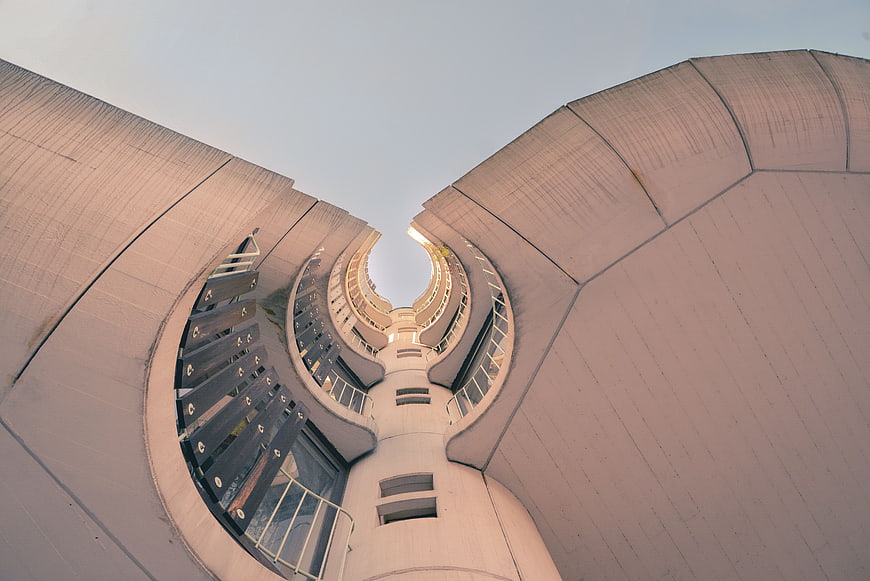 Low angle view of curved modern concrete architecture