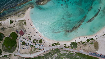 Aerial View of Turquoise Beach Cove with Parking Lot