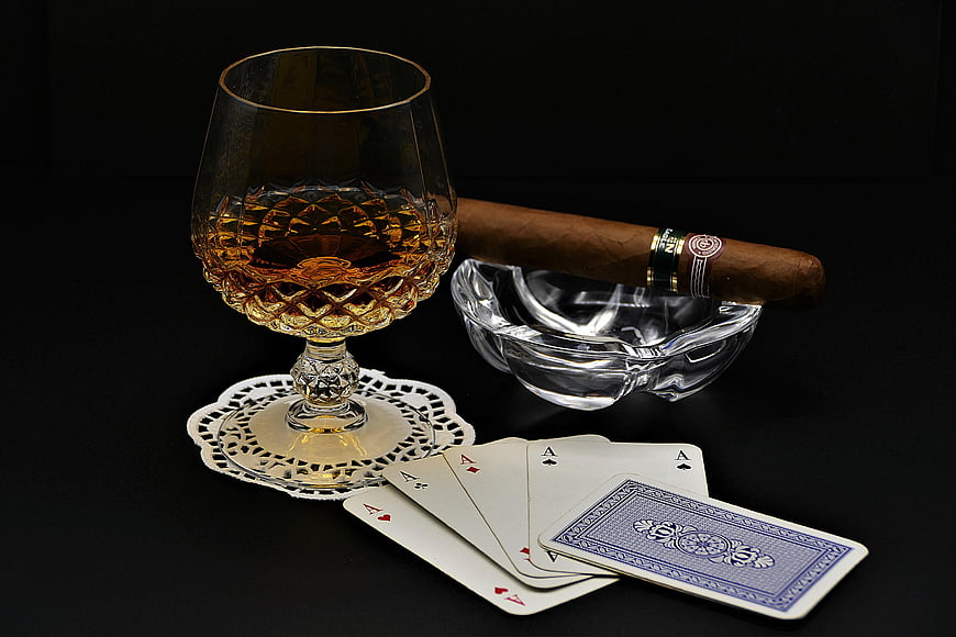 Luxury Still Life With Whiskey Glass, Cigar, Ashtray, And Playing Cards