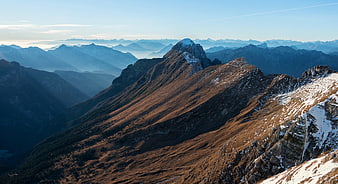 Majestic Mountain Ridge with Snow and Blue Sky