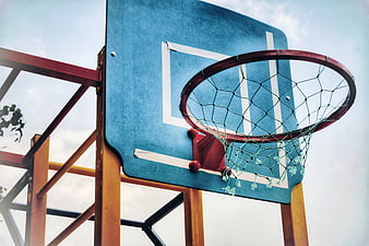 Low angle view of outdoor basketball hoop against sky