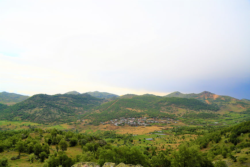 Scenic village nestled in green mountain valley landscape