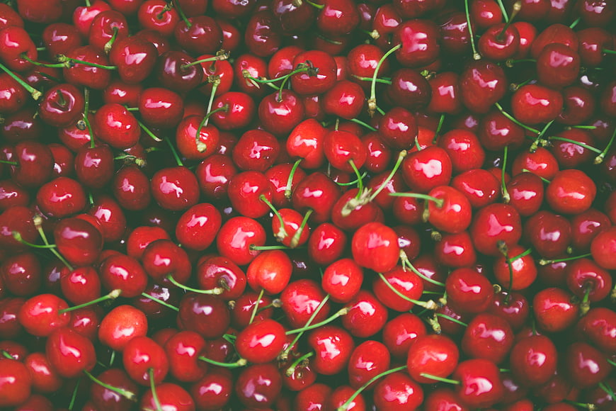 Fresh Red Cherries With Green Stems Close Up