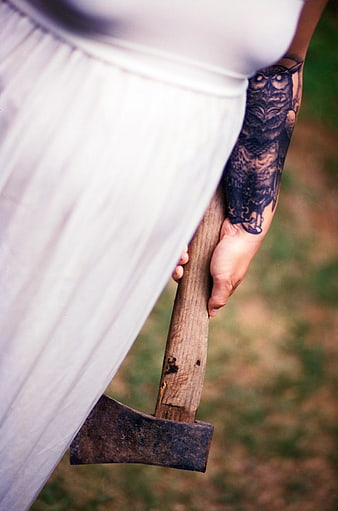 Woman with Owl Tattoo Holding Rusty Axe