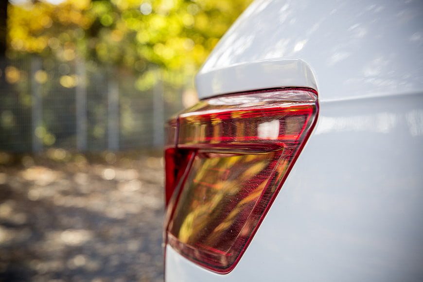 Close-up of white car taillight with blurred background
